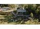 Aerial view of an outdoor concert on the lawn, with a stage, community pool, and trees at 277 Douglas Falls Dr, Wendell, NC 27591