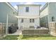 Spacious backyard featuring a seating area with a shade, grill, and lush green lawn at 277 Douglas Falls Dr, Wendell, NC 27591