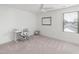 Bright bedroom with neutral carpet, white walls, a desk, and a large window at 277 Douglas Falls Dr, Wendell, NC 27591