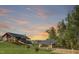Beautiful community clubhouse featuring a sunset view with a walkway and manicured lawn at 277 Douglas Falls Dr, Wendell, NC 27591