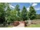 Scenic community bridge offers a charming walkway surrounded by lush trees and landscaping at 277 Douglas Falls Dr, Wendell, NC 27591