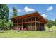 Community pavilion offers a charming outdoor space for relaxation with stone fireplace and comfortable seating at 277 Douglas Falls Dr, Wendell, NC 27591