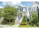 Charming two-story home with white siding, front stairs, and inviting curb appeal at 277 Douglas Falls Dr, Wendell, NC 27591