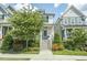 Charming two-story home with white siding, front stairs, and inviting curb appeal at 277 Douglas Falls Dr, Wendell, NC 27591