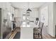 Bright kitchen with white cabinetry, stainless steel appliances, and a center island with seating at 277 Douglas Falls Dr, Wendell, NC 27591