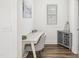 Cozy office nook featuring a small desk, chair, and stylish storage cabinet at 277 Douglas Falls Dr, Wendell, NC 27591