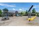 Community playground features a swing set, wooden play structure, picnic table, and nearby walking trails at 277 Douglas Falls Dr, Wendell, NC 27591