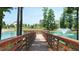 View from the dock of a beautiful fountain on a pond in a desirable community at 277 Douglas Falls Dr, Wendell, NC 27591