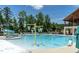 Community pool featuring water slide, shaded lounge chairs, and water features at 277 Douglas Falls Dr, Wendell, NC 27591