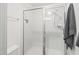 Modern bathroom featuring a glass-enclosed shower with white tiling and a sleek showerhead at 277 Douglas Falls Dr, Wendell, NC 27591