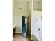 Bathroom featuring a tub with a tiled floor and a doorway leading to a bedroom in the background at 2902 Framer Ln, Durham, NC 27704