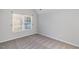Cozy bedroom features neutral paint and carpet with a window providing natural light at 2902 Framer Ln, Durham, NC 27704