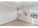 Bright bedroom features neutral carpet, paint, and ample natural light from the double window at 2902 Framer Ln, Durham, NC 27704