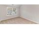 Bedroom with carpet and natural light from the window to the left at 2902 Framer Ln, Durham, NC 27704