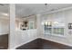 Sun-filled dining area featuring hardwood floors and a chandelier; adjacent to the living room at 2902 Framer Ln, Durham, NC 27704