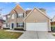 Attractive two-story home with a brick facade, attached two-car garage, and well-maintained landscaping at 2902 Framer Ln, Durham, NC 27704