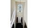 Grand foyer with a striking chandelier and arched window offering abundant natural light and inviting entrance at 2902 Framer Ln, Durham, NC 27704