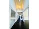 Open foyer with hardwood flooring and views into the adjacent living spaces and staircase at 2902 Framer Ln, Durham, NC 27704
