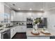 Beautiful kitchen features granite countertops, stainless steel appliances, and white cabinetry at 2902 Framer Ln, Durham, NC 27704