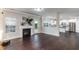 Open concept living room with fireplace, hardwood floors, and direct access to the kitchen at 2902 Framer Ln, Durham, NC 27704