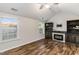 Living room featuring a fireplace with built-in shelving and hardwood floors at 2902 Framer Ln, Durham, NC 27704