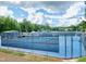 Community tennis courts with covered seating areas and lush green surroundings at 3008 Eden Harbor Ct, Raleigh, NC 27613