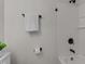 Clean bathroom with white tile shower and matte black fixtures at 306 Coleman St, Oxford, NC 27565