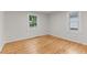 Bright bedroom with hardwood floors and natural light from two windows at 306 Coleman St, Oxford, NC 27565