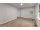 Neutral bedroom with laminate flooring, two closets and access to the backyard at 306 Coleman St, Oxford, NC 27565