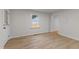This bedroom has wood floors and a window view of the backyard at 306 Coleman St, Oxford, NC 27565
