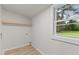 The laundry room has a window, shelf, and updated flooring at 306 Coleman St, Oxford, NC 27565