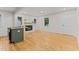 Bright open floor plan with wood floors and modern island overlooking the fireplace at 306 Coleman St, Oxford, NC 27565