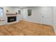 Bright living room with a fireplace, wood floors, and ample natural light at 306 Coleman St, Oxford, NC 27565