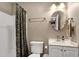 Bathroom with combination tub and shower and vanity with white countertop and sink at 309 Cross Hill Ln, Holly Springs, NC 27540