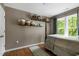 Bedroom with hardwood floors, shelves and natural light at 309 Cross Hill Ln, Holly Springs, NC 27540