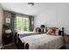 Bright bedroom with hardwood floors and large window at 309 Cross Hill Ln, Holly Springs, NC 27540