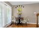 Cozy dining area with natural light streaming through the patio doors, with comfortable seating for two at 309 Cross Hill Ln, Holly Springs, NC 27540