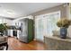 Modern kitchen featuring stainless steel appliances and white cabinets, with dining area at 309 Cross Hill Ln, Holly Springs, NC 27540