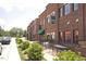 Charming brick commercial buildings along a street with sidewalks and outdoor seating at 309 Cross Hill Ln, Holly Springs, NC 27540