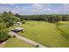 Aerial view of pastures and outbuildings at 3123 Brassfield Rd, Creedmoor, NC 27522