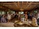 Charming barn with exposed wooden beams, string lights, and tables set for an elegant event at 3123 Brassfield Rd, Creedmoor, NC 27522