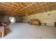 Bright barn interior with open wooden ceiling and chandelier, versatile for events or storage at 3123 Brassfield Rd, Creedmoor, NC 27522