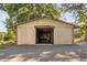 Large barn featuring an open-air design, gravel drive, and shaded location at 3123 Brassfield Rd, Creedmoor, NC 27522