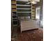 Cozy bedroom with a queen bed, a ceiling fan, and built in shelving at 3123 Brassfield Rd, Creedmoor, NC 27522