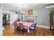 Elegant dining room with a chandelier, hardwood floors, and a classic aesthetic at 3123 Brassfield Rd, Creedmoor, NC 27522