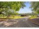 Long gravel driveway leading to the barn at 3123 Brassfield Rd, Creedmoor, NC 27522