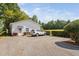 View of the home exterior, gravel driveway, and an SUV parked at the property at 3123 Brassfield Rd, Creedmoor, NC 27522