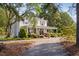 Inviting two-story home with a charming front porch and manicured landscaping at 3123 Brassfield Rd, Creedmoor, NC 27522