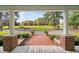 Inviting home view from the porch, showcasing a manicured lawn and mature trees at 3123 Brassfield Rd, Creedmoor, NC 27522