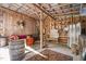 Eclectic interior space with wood walls, a barrel, various artifacts, and decorative displays at 3123 Brassfield Rd, Creedmoor, NC 27522